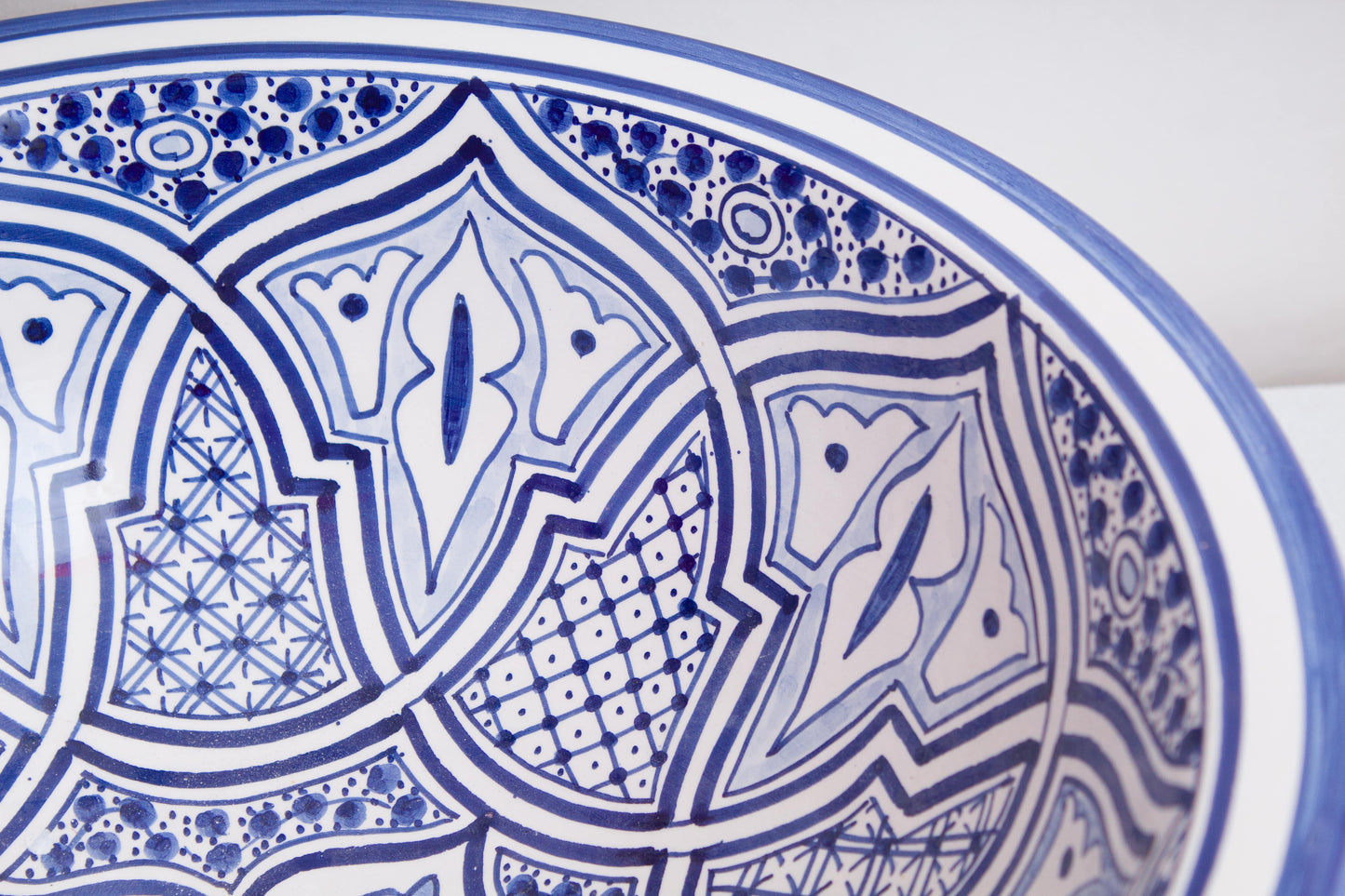 Detailed view of interior geometric and floral motifs featuring blue star patterns and intricate linework