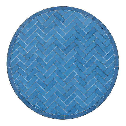 Overhead view of a mosaic patio table made of cobalt blue zellige tiles and featuring herringbone pattern