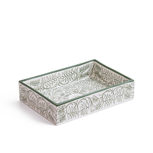 Three-dimensional perspective view of rectangular ceramic sink displaying green botanical line art on white ceramic surface