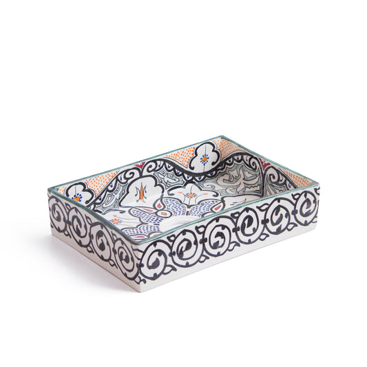 Three-dimensional perspective view of rectangular ceramic sink displaying blue geometric patterns and scrollwork border on white ceramic surface