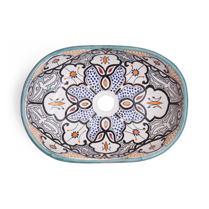 Top-down view of oval ceramic basin displaying central medallion and radiating patterns