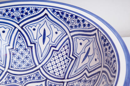 Detailed view of interior geometric and floral motifs featuring blue star patterns and intricate linework