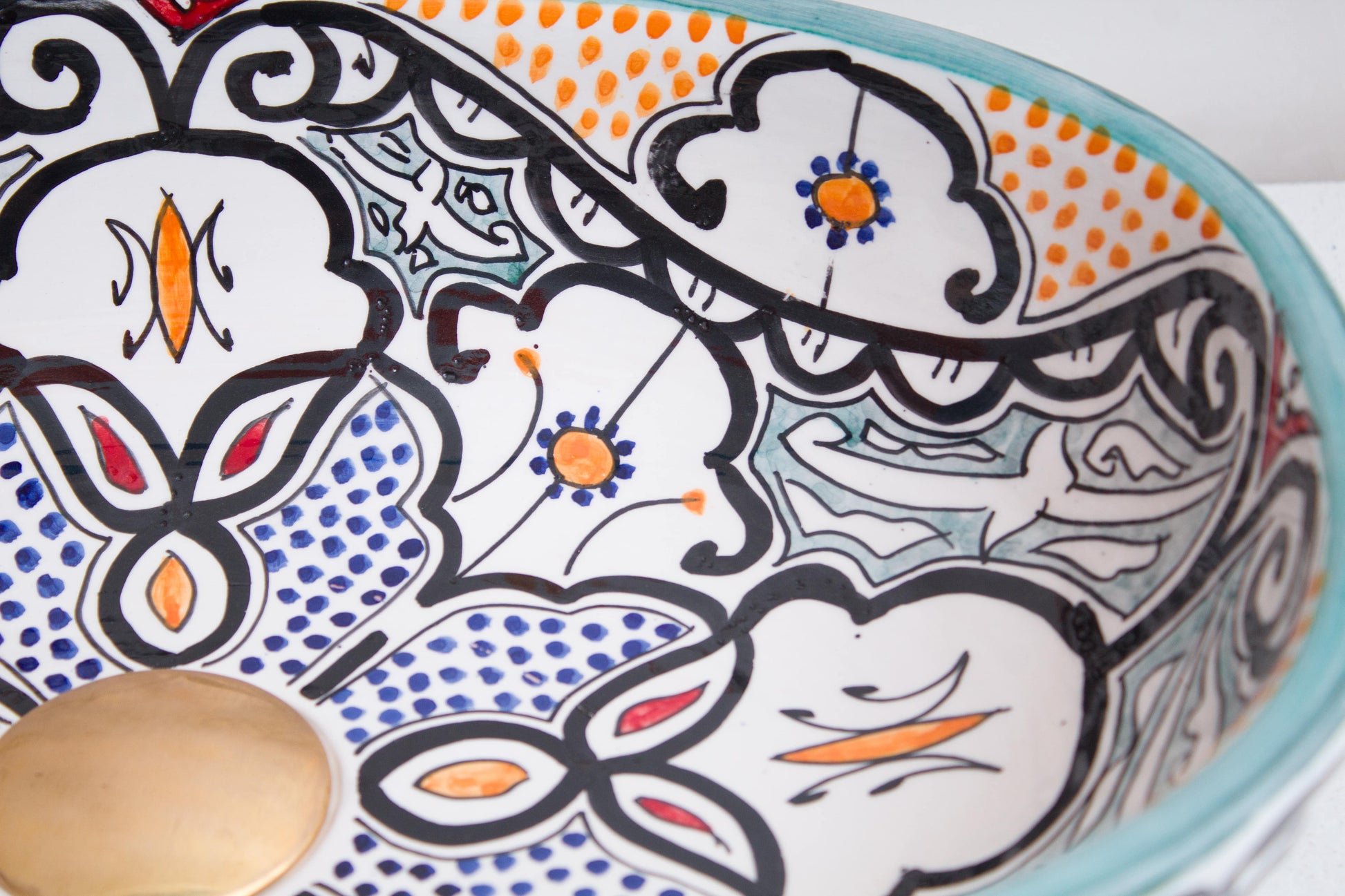Detailed view of interior floral and geometric motifs with orange and blue accents