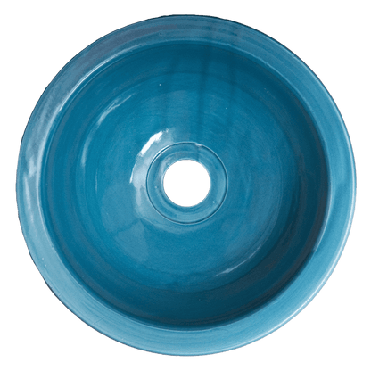 Top-down interior view of blue ceramic vessel sink showing the glazed bowl interior and central drain opening