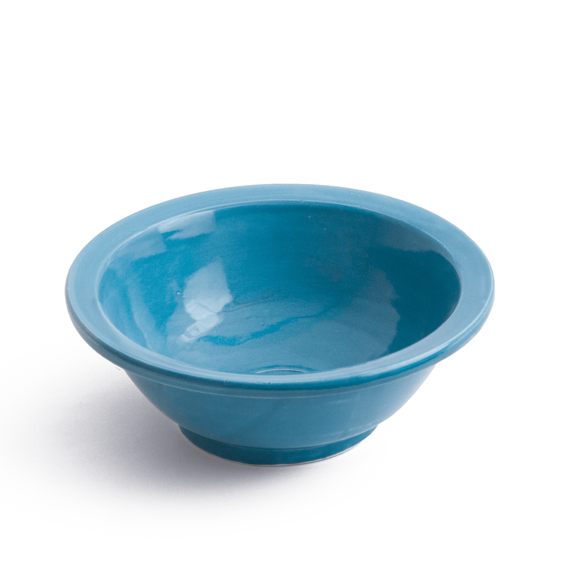 Three-quarter perspective view of blue ceramic vessel sink on white background showing the complete bowl shape and base