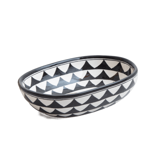 Three-quarter perspective view of compact oval ceramic vessel sink with geometric triangle design on white background showing complete bowl shape
