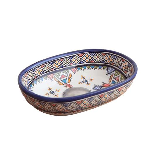Three-quarter perspective view of compact oval ceramic vessel sink with vibrant Berber carnival motifs on white background showing complete bowl shape